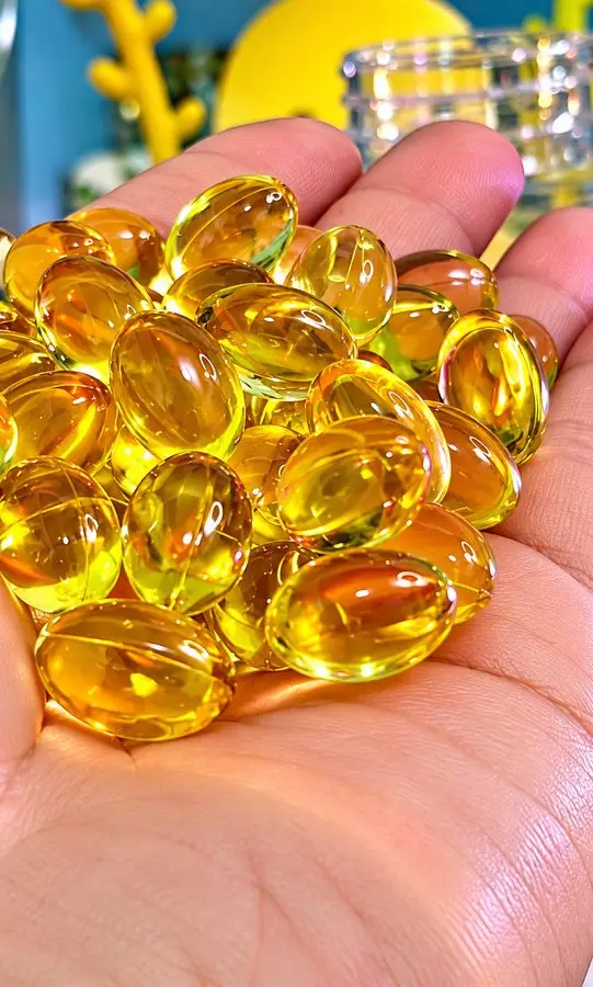Real Lutein Ester capsules held in hand